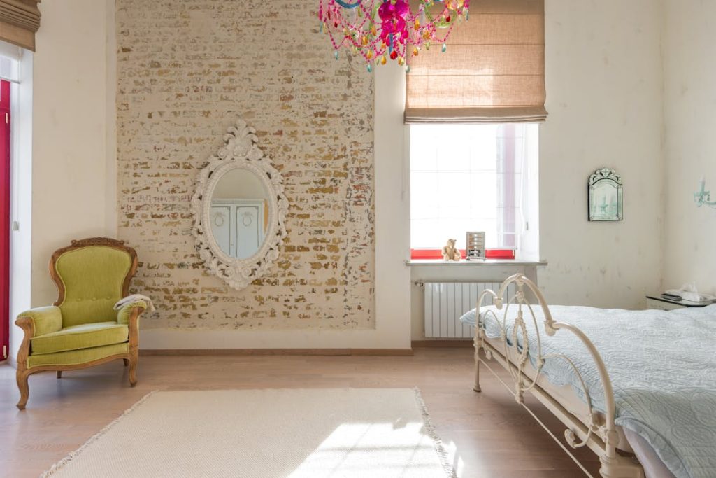 Photo by Max Vakhtbovycn from Pexels: https://www.pexels.com/photo/room-with-bed-and-armchair-and-mirror-8092167/