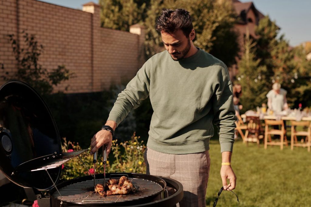 https://www.pexels.com/photo/close-up-shot-of-a-man-grilling-chicken-5637689/
